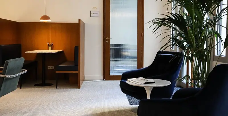 Global Collective Paris | The Bureau Premium Coworking Virtual office rental Paris France - The Bureau elegant exclusive coworking space with wooden private booths, warm lighting and club atmosphere